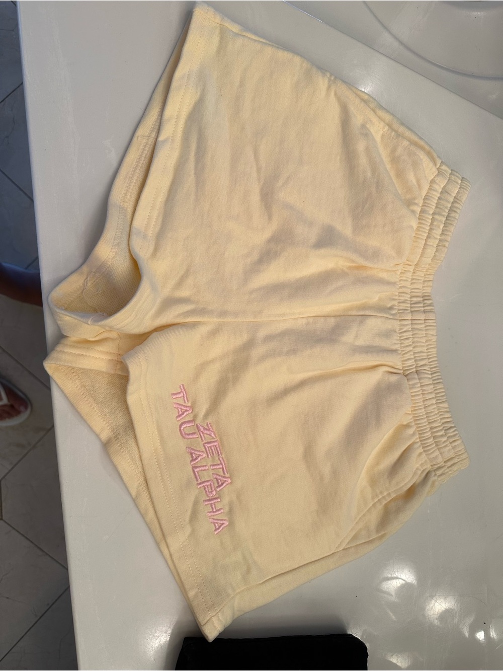 Yellow Embroidered Shorts with Pink Script